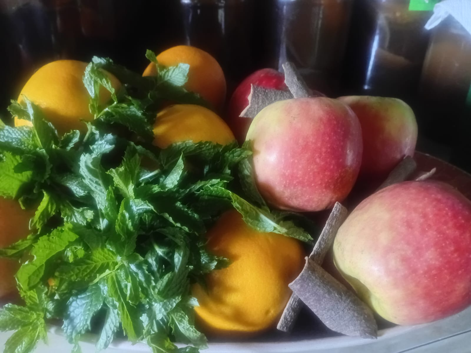 Fresh oranges, apples, mint leaves and cinnamon sticks ready for the next batch of Krazy Kombucha